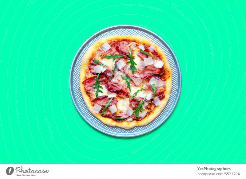 Homemade prosciutto pizza minimalist on a green table above arugula background baked bright chart cheese color colorful comfort crust cuisine delicious dinner