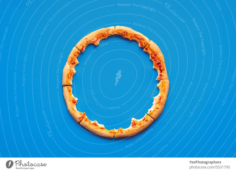 Pizza crust leftovers top view on a blue background above abstract baked bites bright chart cheese color colorful comfort concept crumbs cuisine delicious