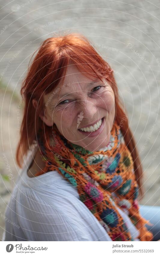 Far Land | Hello Sunshine Woman Joy Laughter Contentment red hair Scarf Crocheted Sit portrait Happiness cheerful beautiful teeth naturally