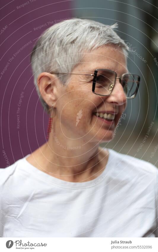 Wide land | Laughing woman with glasses Woman Eyeglasses short hair Gray-haired Earring Person wearing glasses Laughter kind Funny Happiness purple