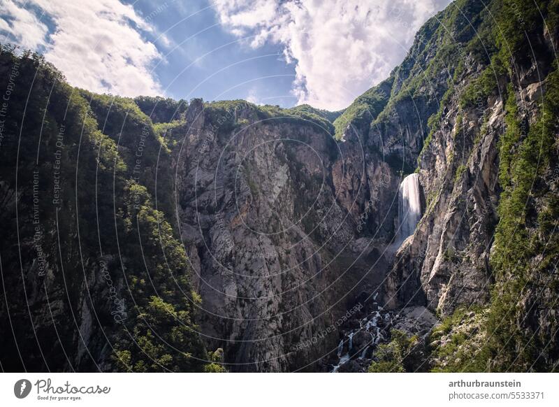 Boka waterfall with blue sky and clouds in Soca valley in Slovenia in summer boka boka waterfall Water Waterfall Mountain mountains mountain landscape Rock