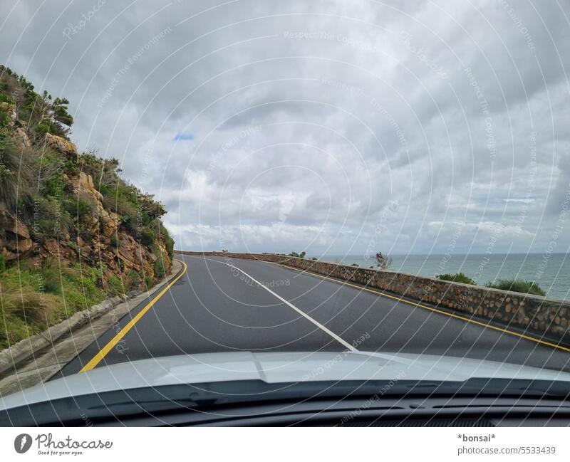 Coastal road Clarens Drive Street Rock Ocean Horizon Clouds Sky car Motoring Windscreen Traffic lane Lane markings Roadside Whale Route Western Cape