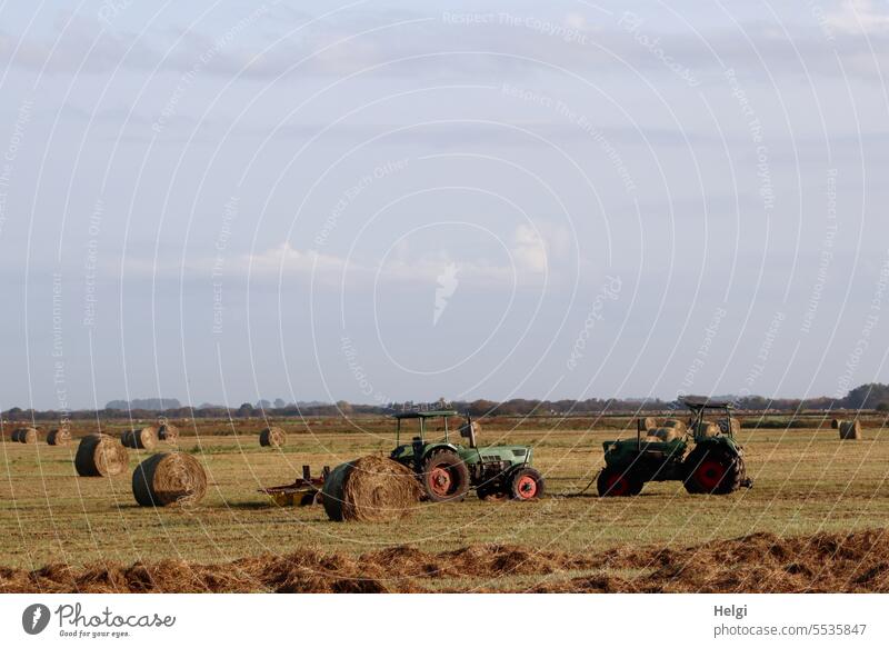 nostalgic agriculture Tractor two Agricultural machinery Old Historic nostalgically Meadow Hay bale round bales Hay harvest Bog Meadows Ochsenmoor Landscape