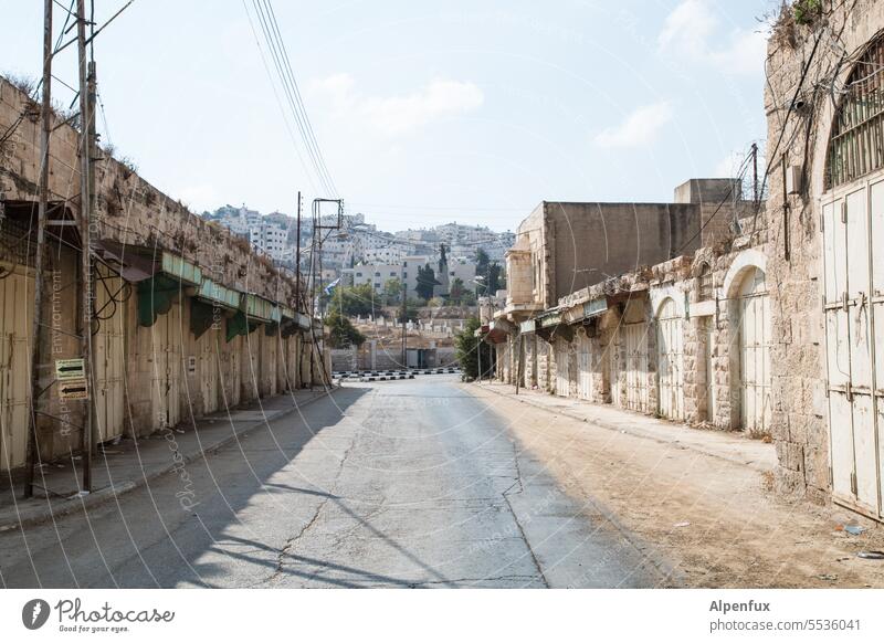 Empty road in Palestine empty street forsake sb./sth. Loneliness Street void palaestine Hebron end of the road Lanes & trails Closed closed stores