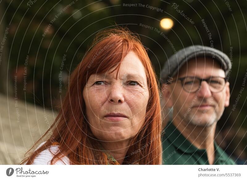 Wide land | double portrait of woman in foreground and man in background people 2 people Couple Man Woman Double portrait Man with cap Man with glasses red hair
