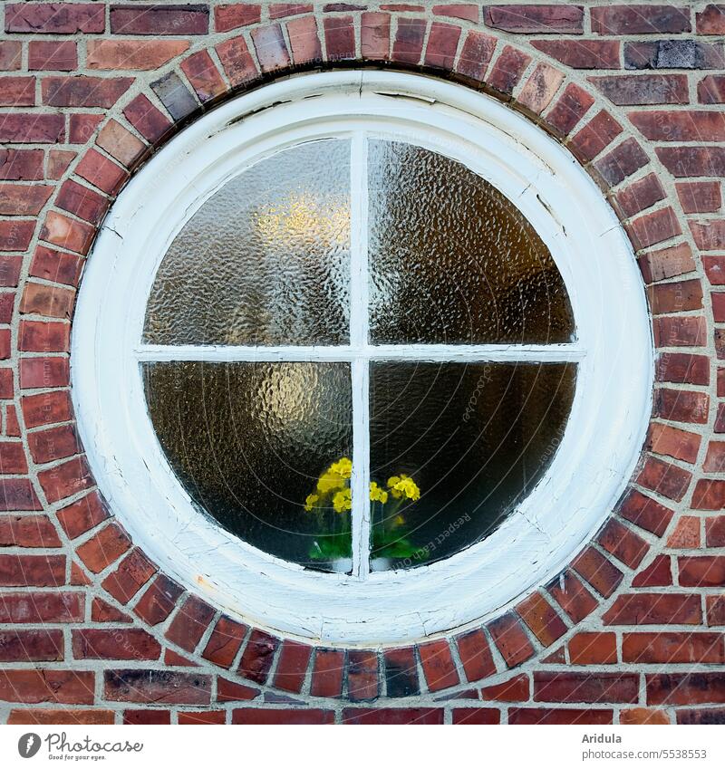 Round white framed window with window cross in brick wall Window Crucifix Window transom and mullion House (Residential Structure) Brick Brick wall