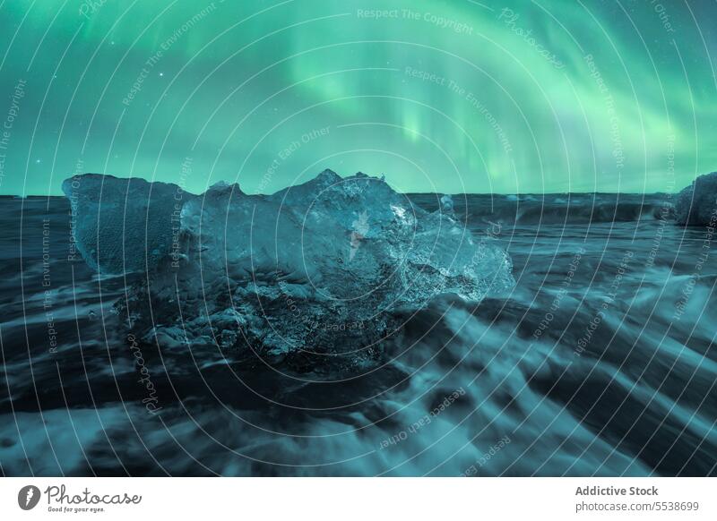 Broken ice floating in sea water on black beach in Iceland iceland aurora borealis northern lights highland landscape coast wave ocean ripple sky diamond beach