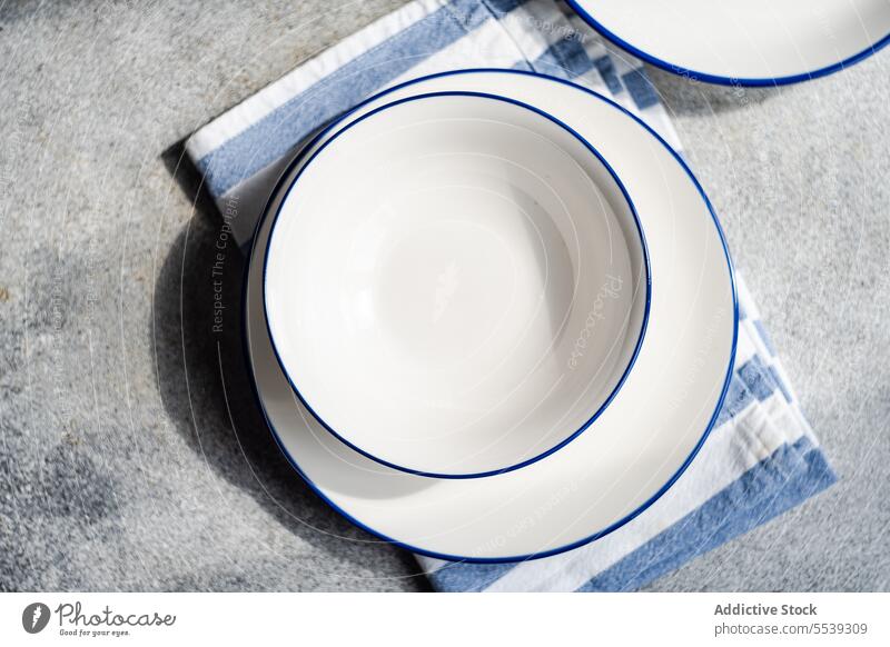 Minimalistic rustic table setting on gray surface plate napkin decor serve tableware dinnerware arrangement decoration utensil ceramic occasion creative