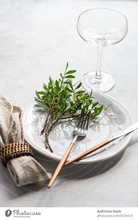 Table decoration with fresh pistachio plant plate knife silverware fork napkin cutlery serve tableware dinnerware arrangement utensil ceramic occasion creative