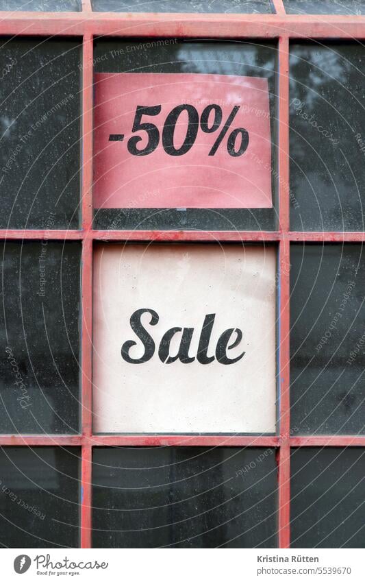 -50% sale Sale minus fifty Percent percentages Closing-down sale half prices Discount bargain Half halved sign Piece of paper Window Lattice window Business