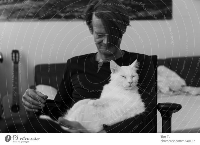 Man with cat Cat b/w White hangover bnw Black & white photo Day Interior shot