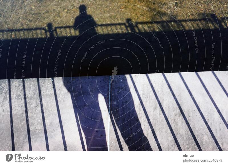Parallel world I shadow of a person on a bridge and in the water Shadow Shadow play Bridge Water Bridge railing double shadow thick - thin compromise