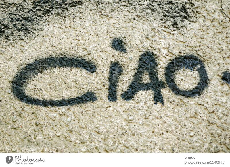 CIAO is written in black on a wall ciao goodbye Italian Bye Goodbye. Graffiti Design Daub house wall Youth culture Hi! Blog valediction Greeting informally