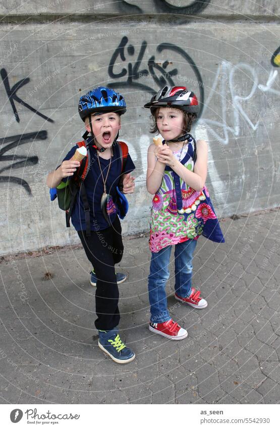 Wild Kids on the block children two graffiti variegated sneakers Bike helmet Red Blue urban Girl Boy (child) Blonde Brunette Brash Ice Eating ice cream Infancy