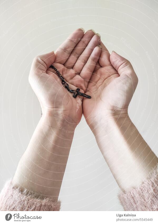 Hands holding a cross while praying Christianity Prayer God religion Catholicism Holy Belief hands praying hands Cross Jesus Christ catholic Baptism lutheran