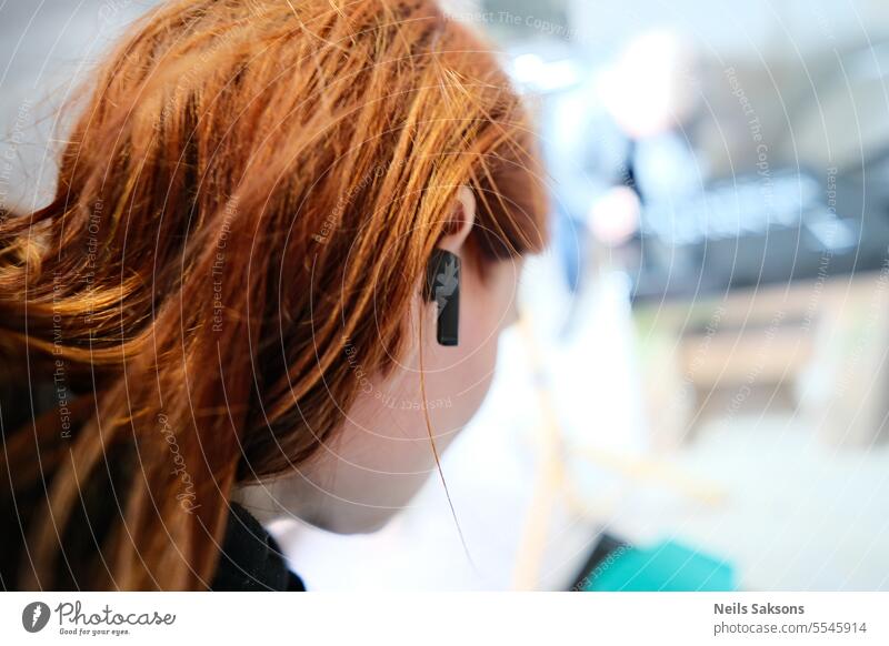 Headphones and red hair Red Earplugs Music Listening Listen to music Technology Hair Girl Woman youthful listen To enjoy Joy portrait Modern person Sound Happy