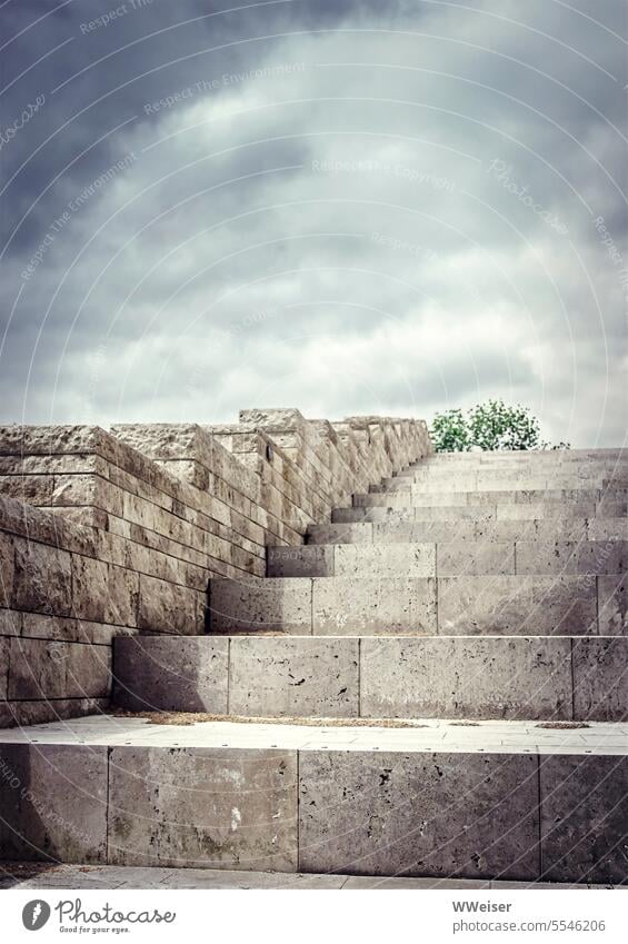 A steep staircase made of large, heavy stone blocks leads somewhere to the top Stairs stagger Ascending Tall Above up Wall (building) Marble out Modern Sky
