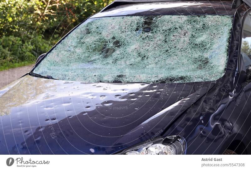 Hail damage to a car. Large hailstones have completely destroyed a car hail damage Damage Broken corrupted Accident Vehicle Transport Case of damage Destruction