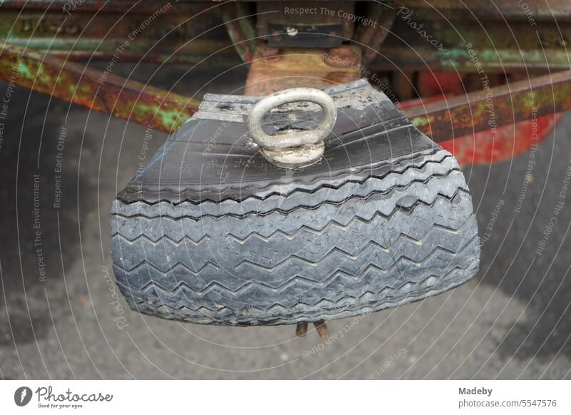 Segment of an old car tire as protection and bumper of a tractor of the fifties with rust and patina at the Oldtimertreffen Golden Oldies in Wettenberg Krofdorf-Gleiberg near Giessen in Hesse