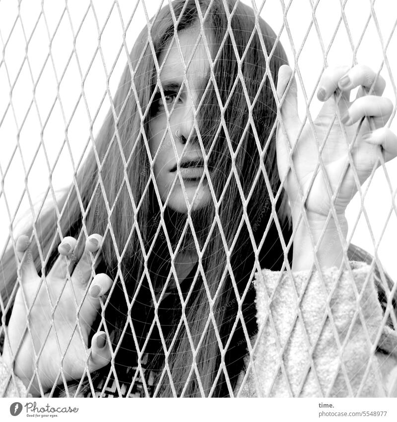 Stories from the fence .138 Feminine Woman Long-haired Jacket Fence Observe To hold on Looking Surprise Concern Pain Sadness Disappointment Exhaustion Fear