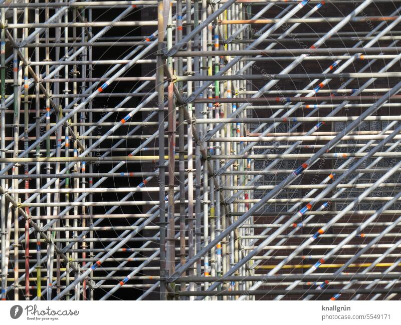 Large scaffolding Scaffold Construction site Metal Deserted Exterior shot Scaffolding Facade Redecorate Architecture Redevelop Structures and shapes Change