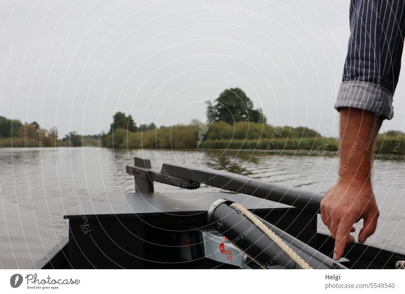 Wide land | Helmsman Coxswain arm Hand boat tax Water River Boating trip River bank Landscape Nature Sky steer Steering Colour photo Exterior shot Day Tourism