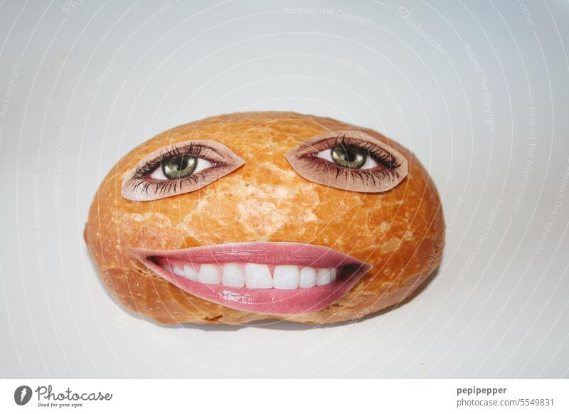 delicious bun with glued on eyes and mouth from a magazine Roll manger roll wake alarm Food Bread Eating Studio shot Mouth Teeth Show your teeth