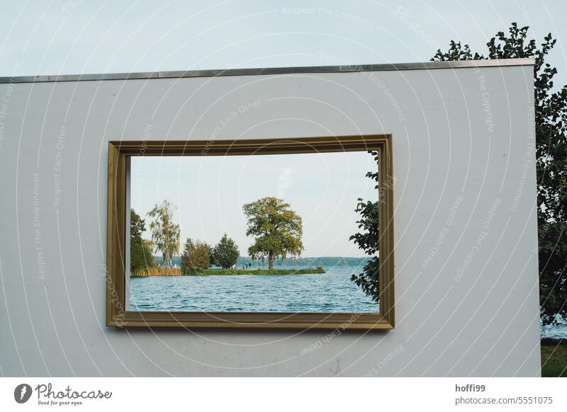 Everything in the frame - view of a small island through a picture frame Island Picture frame Schweriner See framed Exterior shot Lake Nature Water
