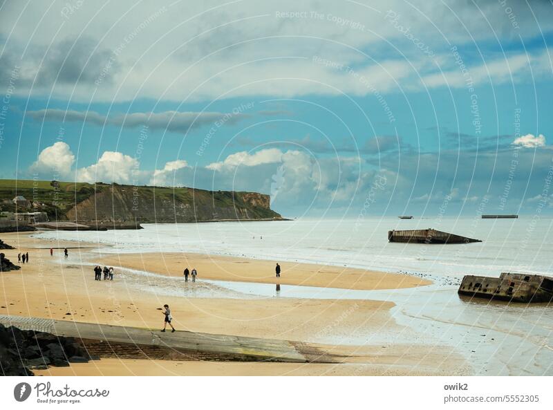 Arromanches-les-Bains Beach Water Ocean Atlantic Ocean France Normandie people group Multiple In transit recover relax stroll stop coast Nature Landscape Sky