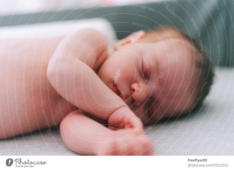 Portrait of a newborn sleeping on a baby crib nap lying diaper diapers parenthood motherhood innocence life labor young boy happy small pregnancy little
