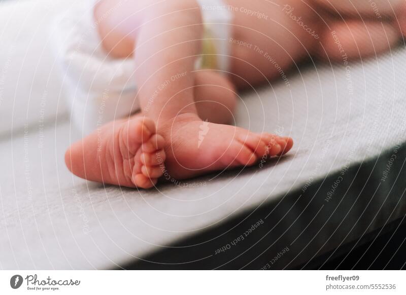 Detail of the feet of a newborn sleeping on a baby crib parenthood motherhood innocence life labor young boy happy small pregnancy little childhood maternity