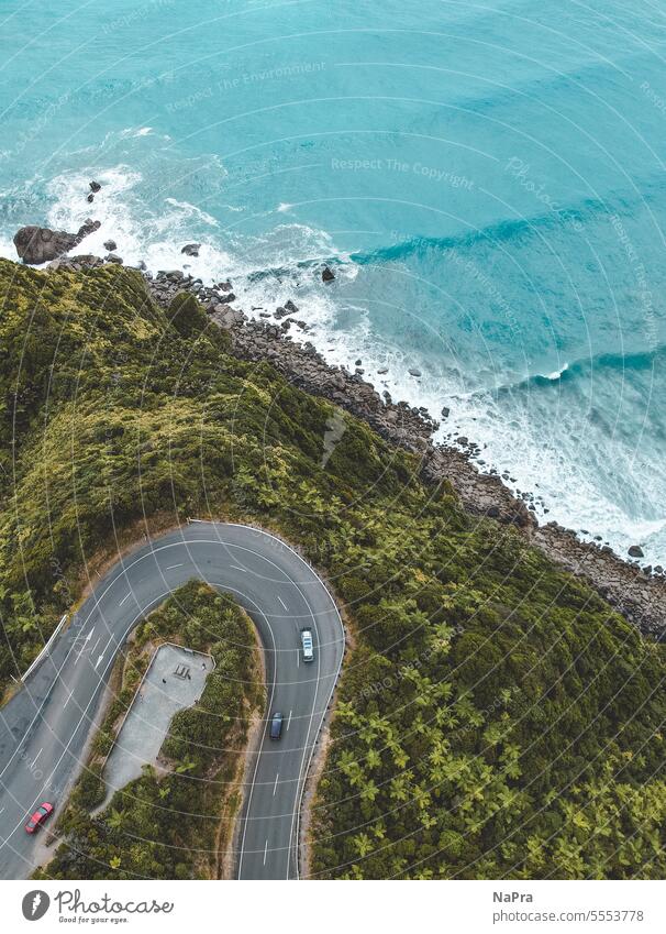 Road curve on a coast from above Street Curve drone Above Ocean Beach jungles Blue Landscape Nature Water Exterior shot Green hairpin bend New Zealand wave