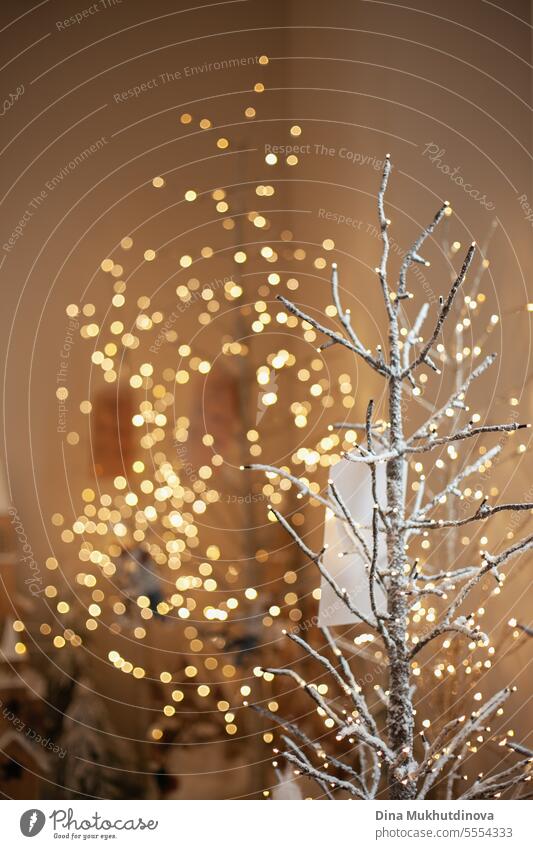tree branch with lights bokeh Christmas decoration closeup at xmas home decor market christmas golden plant leaves leaf greeting winter background celebration