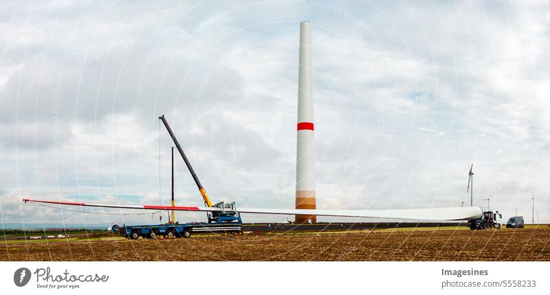 Wind turbines under construction. Rotor blade for wind turbines at close range. Special transport of a blade for a wind turbine on a special semi-trailer.