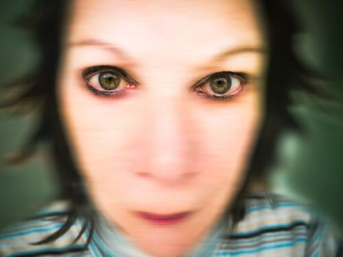 Fearful eyes of a woman Woman portrait anxiety Human being Adults Feminine Face blurred Young woman blurred background Head Hair and hairstyles Unnatural warped