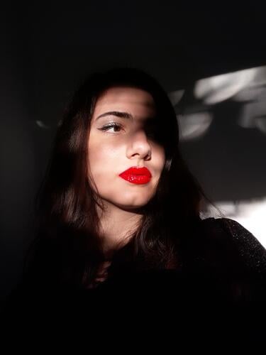 Shadow play on the face of a woman with red lipstick Model eyeliner Retro Lipgloss Hip & trendy Beauty Photography make-up Fashion Visual spectacle Light