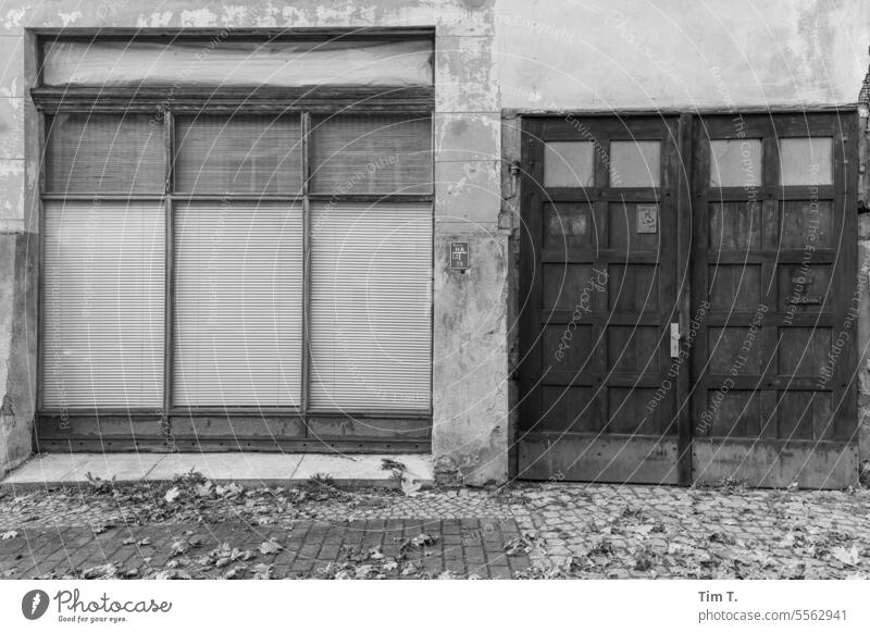Window and door in a village b/w Village Brandenburg Autumn Closed Load Black & white photo Deserted Day Exterior shot B/W B&W Calm Architecture