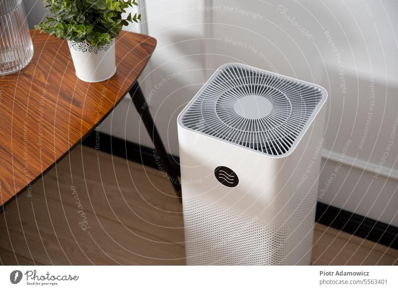 Air purifier in living room, dust protection air cleaner indoor conditioning system climate comfort fan smoke conditioner electric health breathe comfortable