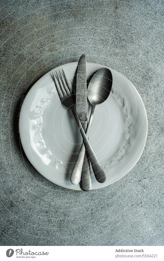 Vintage cutlery set on gray surface spoon silverware kitchen utensil table texture dishware kitchenware metal silver - metal silver colored fork
