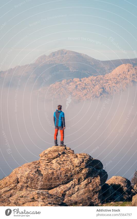 Silhouette of a man on top of the mountain silhouette freedom adventure success male person lifestyle landscape journey high hill peak climbing hiking rock