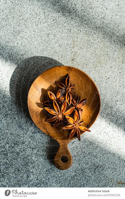 Bowl with anise on table bowl star aroma spice seed background natural food rustic healthy aromatic dried organic ingredient cuisine product wooden culinary