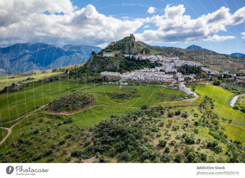 Mountains with green valley and village under cloudy sky mountain hill road landscape countryside nature ridge scenic Zahara de la Sierra spain scenery