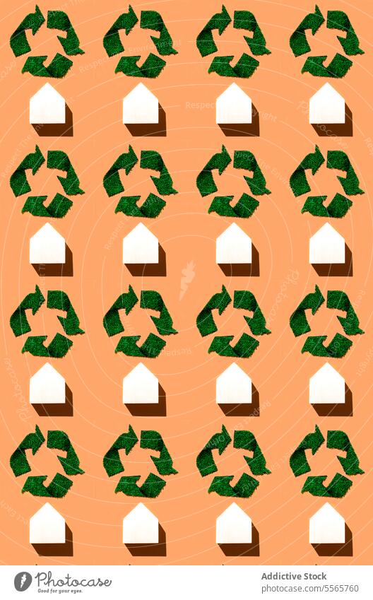 A group of sustainable symbol of recycling on an orange background green shapes composition vibrant geometric colors design abstract art modern graphic pattern