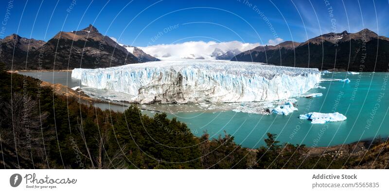 A large glacier in the middle of a lake surrounded by mountains nature Patagonia Argentina ice water landscape scenic natural wilderness adventure outdoors