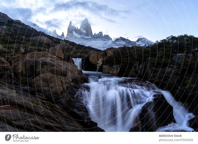 A waterfall with a mountain in the background nature landscape argentinian Patagonia cascade scenic beauty outdoors wilderness adventure hiking exploring travel