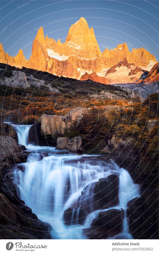 A waterfall with a mountain in the background nature landscape argentinian Patagonia cascade scenic beauty outdoors wilderness adventure hiking exploring travel