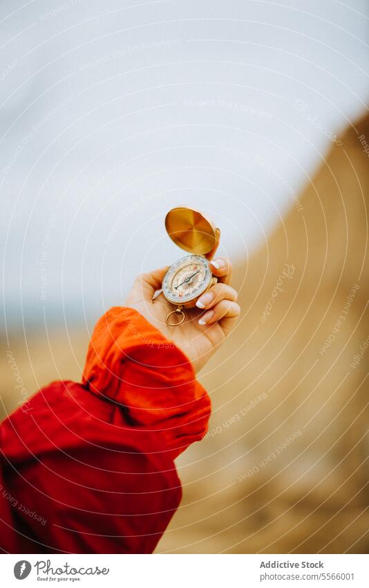 A person holding a compass in their hand desert navigation traveler landscape adventure bardenas reales navarra exploration direction map outdoor wilderness