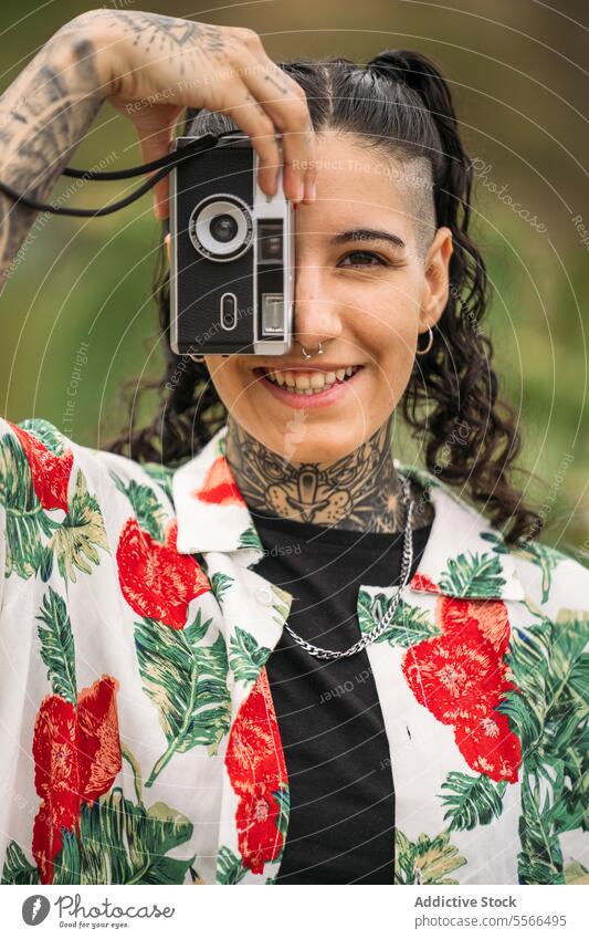 Smiling tattooed woman taking photo stylish nature enjoying standing attractive young fashion female pretty style cool beauty trendy casual youth leisure