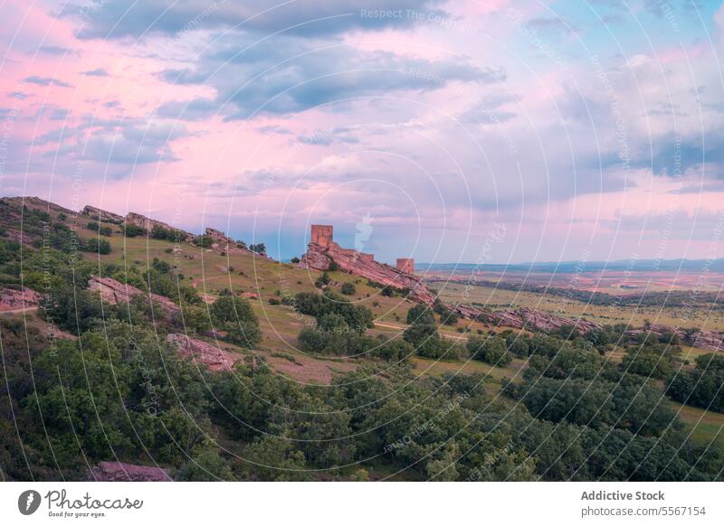 Twilight over Zafra Castle Cuenca open air panoramic view twilight rocky hill greenery pastel sky fortress landmark nature scenic landscape heritage ancient