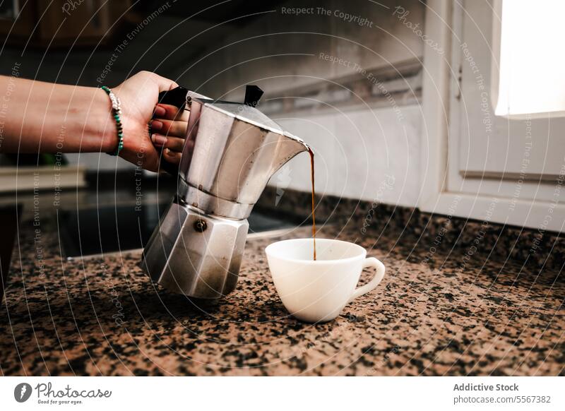 Morning pour ritual hand bracelet turquoise coffee espresso maker stovetop cup kitchen modern brew counter morning handle grip steam countertop ceramic mug